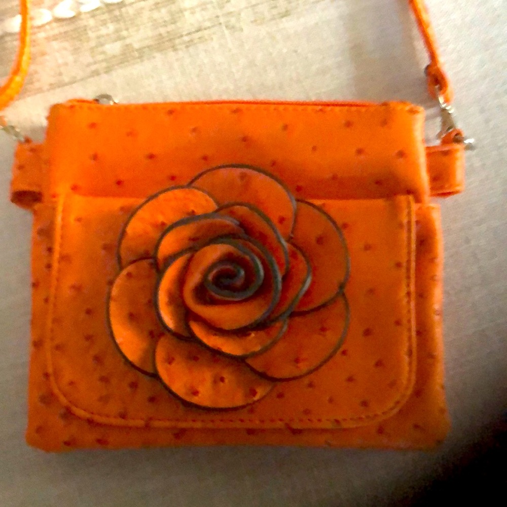 Orange faux leather crossbody with floral detail